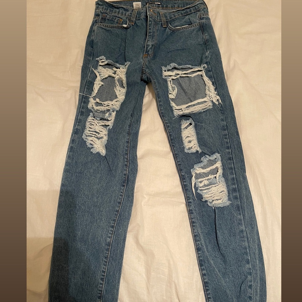 Fashion Nova ripped boyfriend jeans.